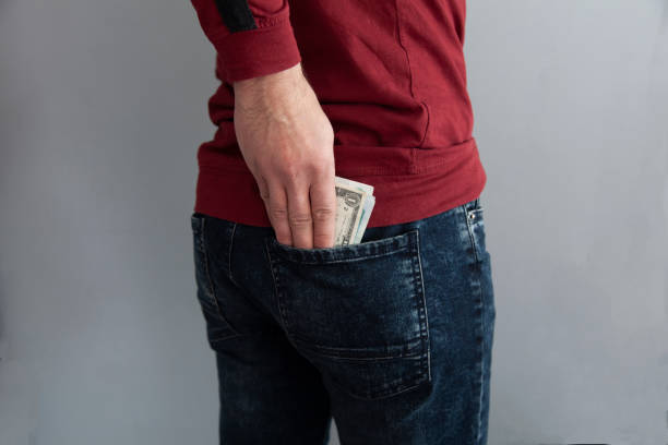 istock man hand money in pocket 1202538382