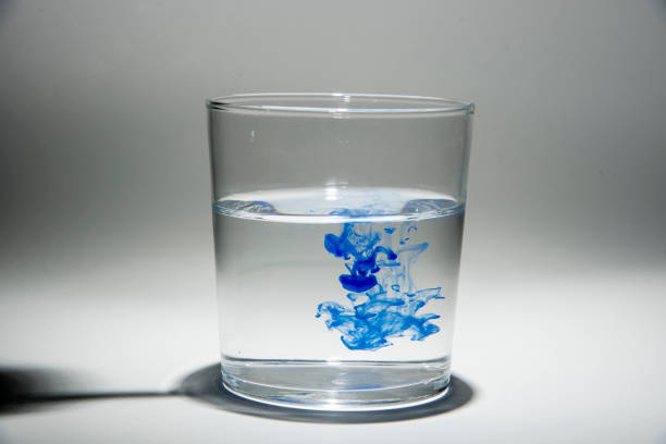 istock Watercolor pigment on transparent water 1202538828