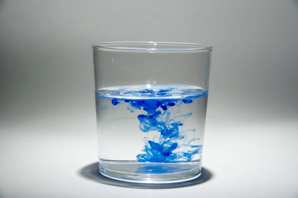 istock Watercolor pigment on transparent water 1202538875