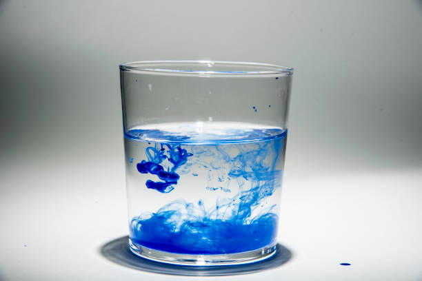 istock Watercolor pigment on transparent water 1202538895