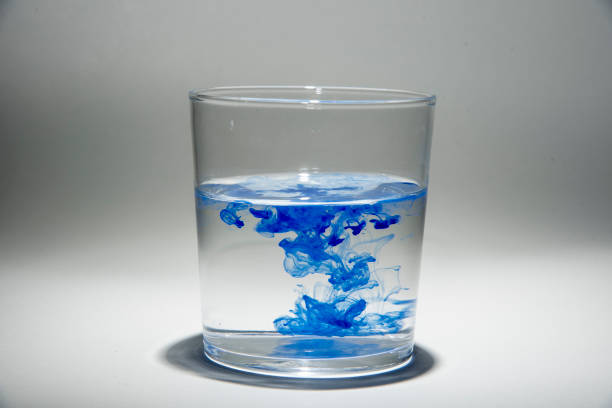 istock Watercolor pigment on transparent water 1202538982