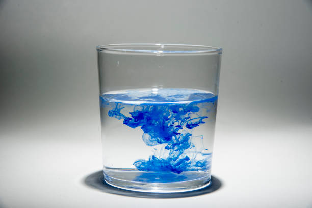 istock Watercolor pigment on transparent water 1202539079