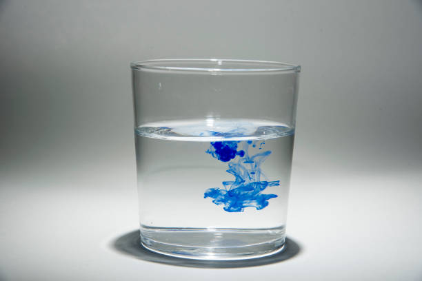 istock Watercolor pigment on transparent water 1202539119