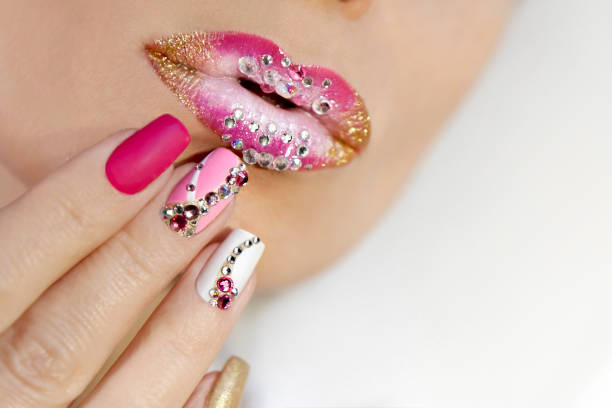 istock Creative lip makeup and trendy nail art manicure 1202540532