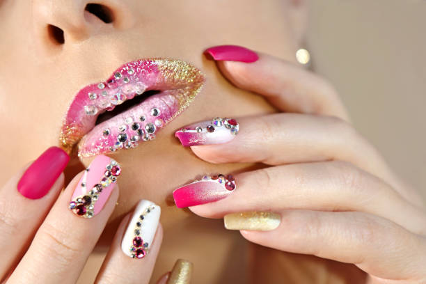 istock Creative lip makeup and trendy nail art manicure 1202540536