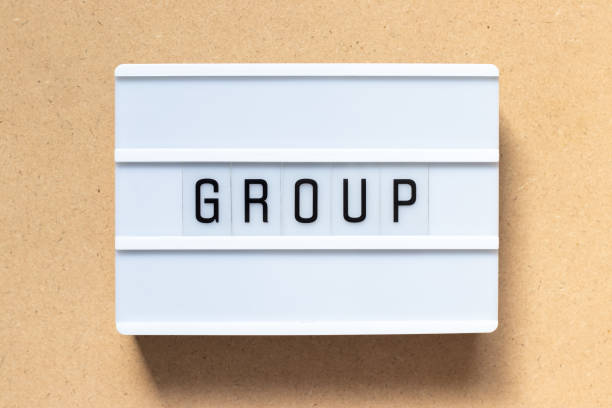 istock White lightbox with word group on wood background 1202541109
