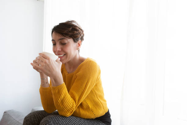 istock Young woman relaxing at home 1202541128