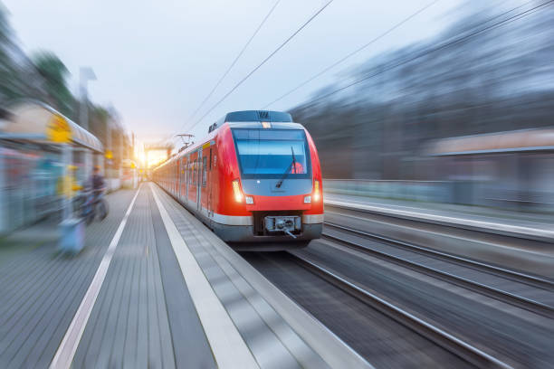 istock Passenger high speed red train with motion blur in station. 1202541266