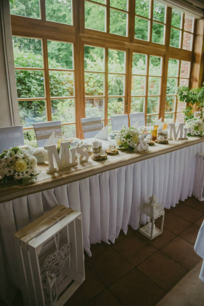 istock Beautifully decorated wedding table and other details at wedding hall. Wedding day. 1202541778