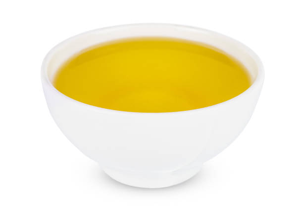 istock Sunflower oil in white bowl Isolated on a white background. 1202543169