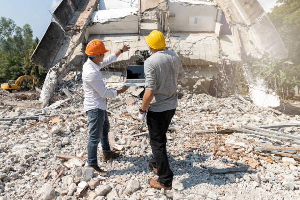 istock Demolition control supervisor and foreman discussing on demolish building. 1202543206