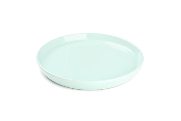 istock Green clean plate isolated on white background. Kitchen, serving 1202543803