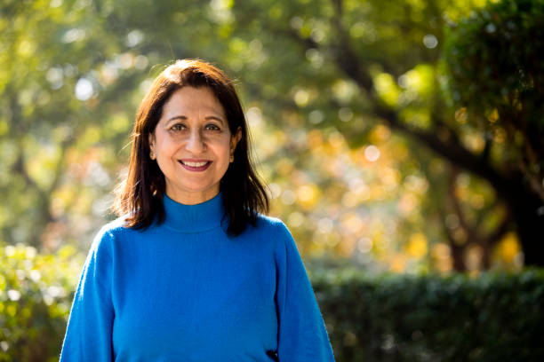 istock Confident senior woman looking at camera outdoor 1202543842