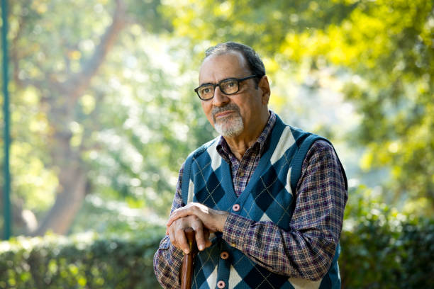 istock Thoughtful old man sitting on park alone 1202544823