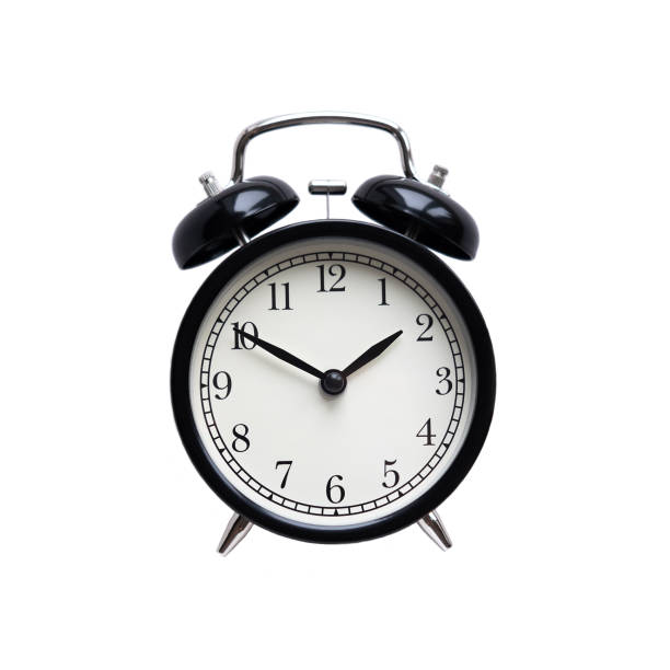 istock Black classic style alarm clock isolated on white background 1202545373