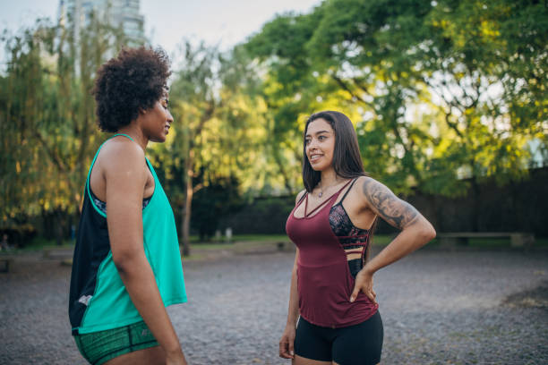 istock Two ladies exercising in city park 1202546563