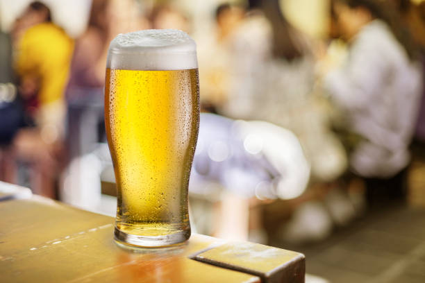 istock Glass of beer stands on a table in a pub. Light beer. 1202548532