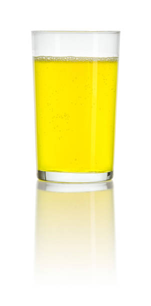 istock Glass filled with an orange soft drink 1202548789