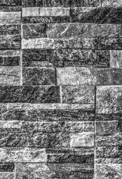 A background of stone wall in black and white close up view