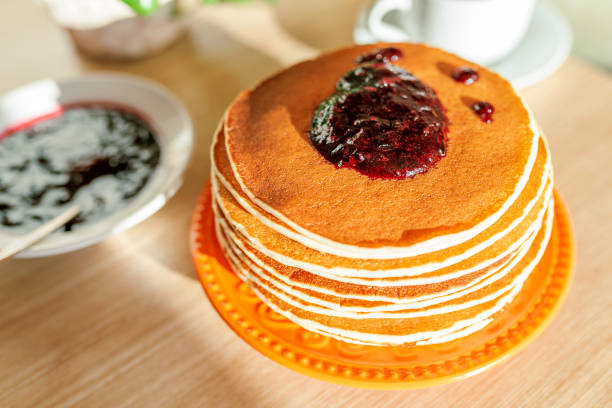 Real food. Pancakes on the table with home flower. Authentic breakfast stock photo