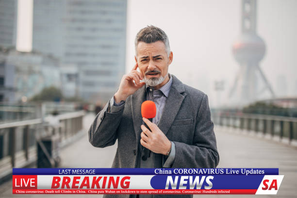 istock Breaking news reporter reporting on coronavirus from downtown Shanghai 1202550052
