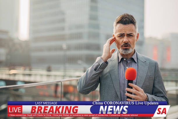 istock Breaking news reporter reporting on coronavirus from China 1202550079