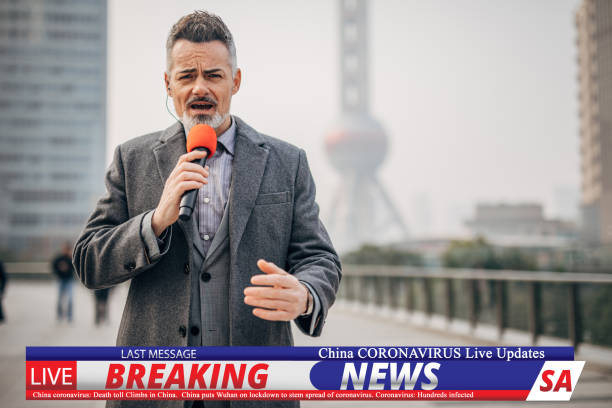 istock Breaking news reporter reporting on coronavirus from China 1202550143