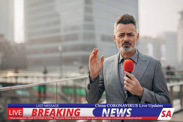 istock Breaking news reporter reporting on coronavirus from China 1202550207
