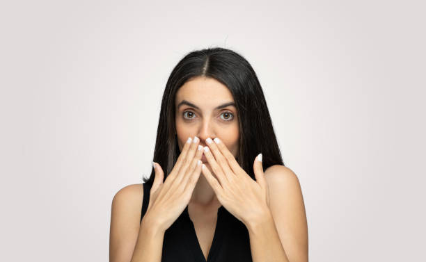 istock Portrait of shocked young man over white background 1202550949