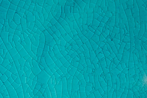 istock Blue background. Cracks in ceramics porcelain, macro 1202551100