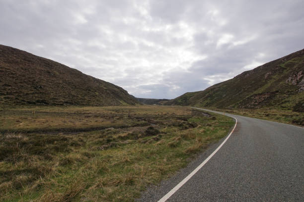 istock Road through a valley on the Isle of Lewis 1202551793