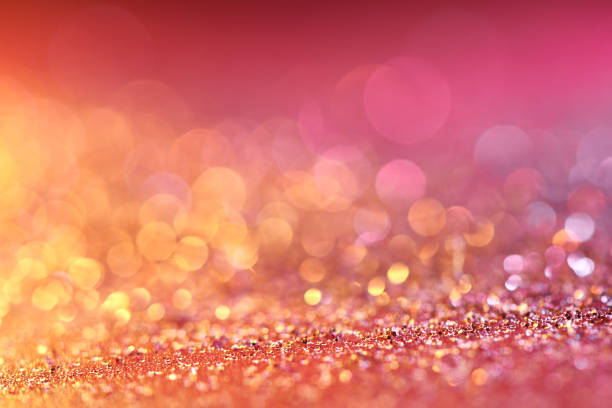 istock Red blurred abstract shiny valentines day background with bokeh effect, festive pink glitter sparkles 1202552160