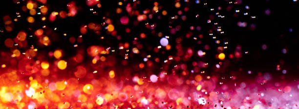 istock Red blurred abstract shiny valentines day background with bokeh effect, festive pink glitter sparkles 1202552170