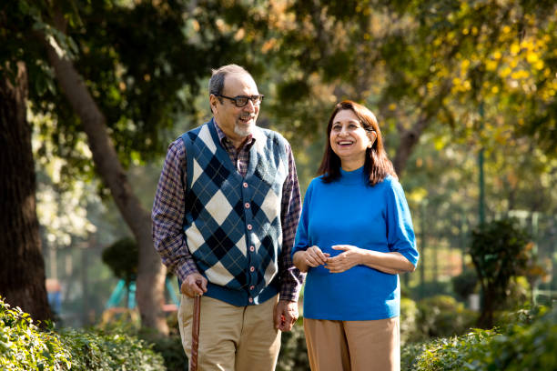 Happy senior couple admiring view at park Happy senior couple admiring view outdoor indian man walking in park stock pictures, royalty-free photos & images