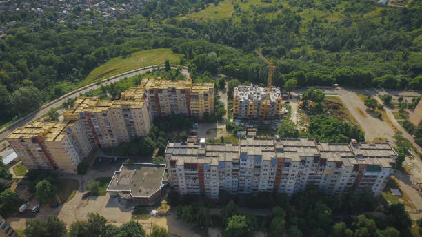 istock Aerial Building Process of Construction Site. Engineers crane and city. 1202553720