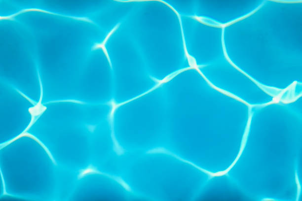 istock Swimming Pool water. Ripple Water. Sun Reflection background. 1202555601