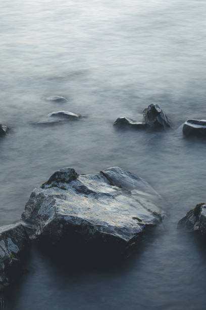 istock Long exposure of waves and rocks at dawn 1202556001