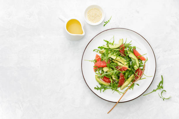 istock Detox grapefruit and arugula salad, top down view 1202556936