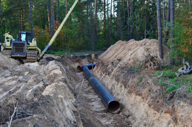 istock Crawler crane with side boom or pipelayer bulldozer. Natural gas pipeline construction work. 1202557519