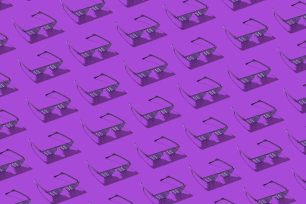 Diagonal pattern from computer pixel glasses. Creative pattern from protective pixel glasses using for work with computer screens, phones and TV on a purple background with hard shadows. meme photos stock pictures, royalty-free photos & images