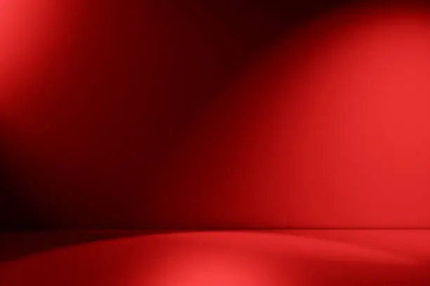 Red empty Studio room for product placement or as a design template with wall angle in a full frame view
