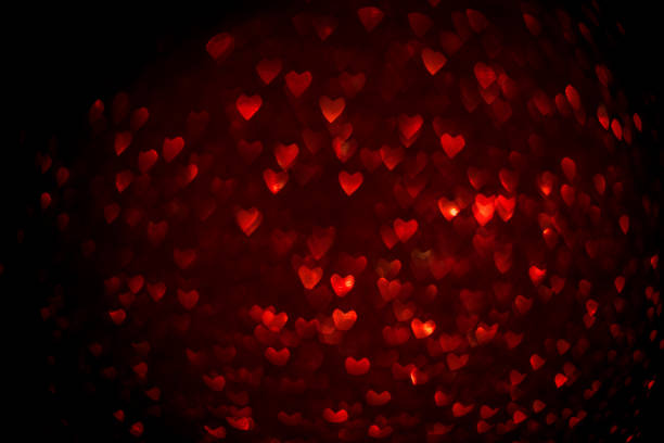 istock Background with red bokeh in the shape of a heart. 1202562440