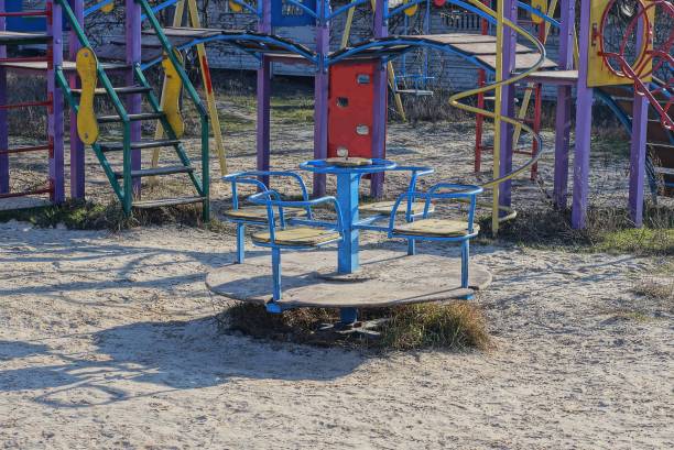 istock childrens playground with a one round colored carousel 1202563920