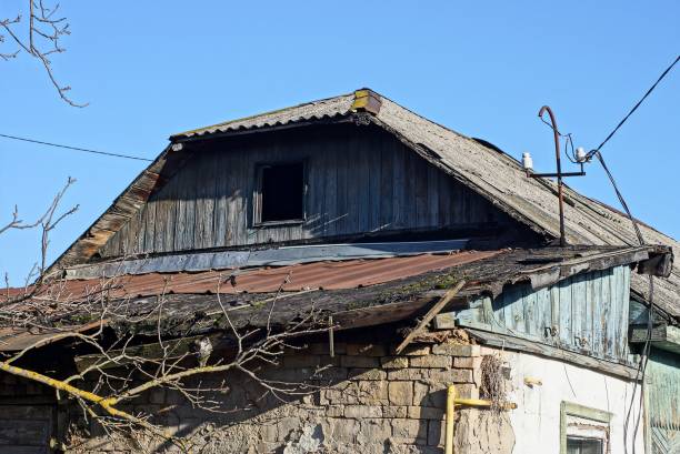 istock old gray wooden loft with a small empty window on an old rural house 1202564145