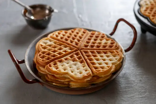 Close-up of Soft Viennese Waffles and Waffle Makers