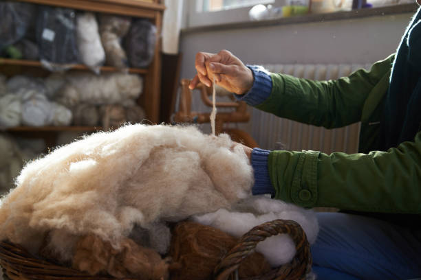 handmade manufacturing yarns from natural sheep wool - lã imagens e fotografias de stock