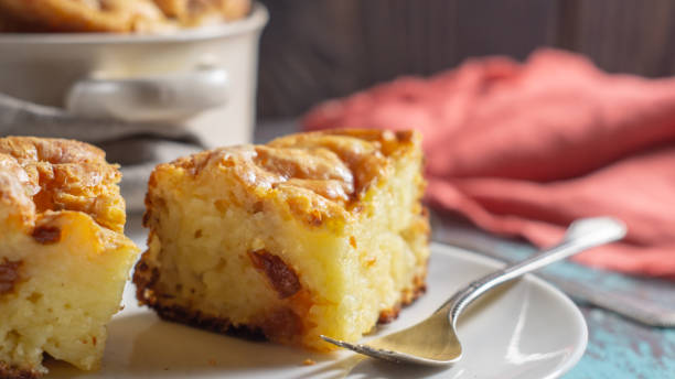 istock Cottage cheese casserole on a white plate and in a saucepan 1202566539