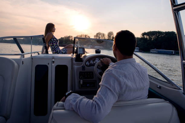istock Couple on vacation, sunset, sea and ship 1202566777