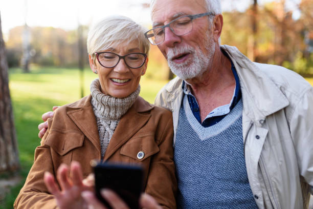 istock Cheerful seniors using modern technology. Taking selfie photos. 1202566964