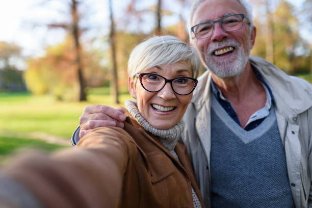 istock Cheerful seniors using modern technology. Taking selfie photos. 1202567268